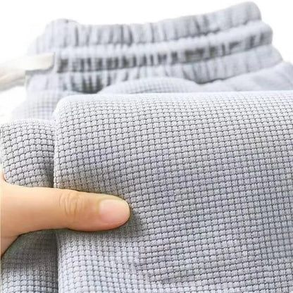 Men's retro knitted Waffle sweatpants, loose straight leg solid color pants with elastic waist and drawstring, suitable for autu.