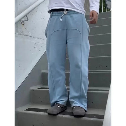 Casual Elastic Drawstring Zipper Pants High Street Hip Hop Streetwear Loose Fit Men's Trousers for Casual Scenarios.