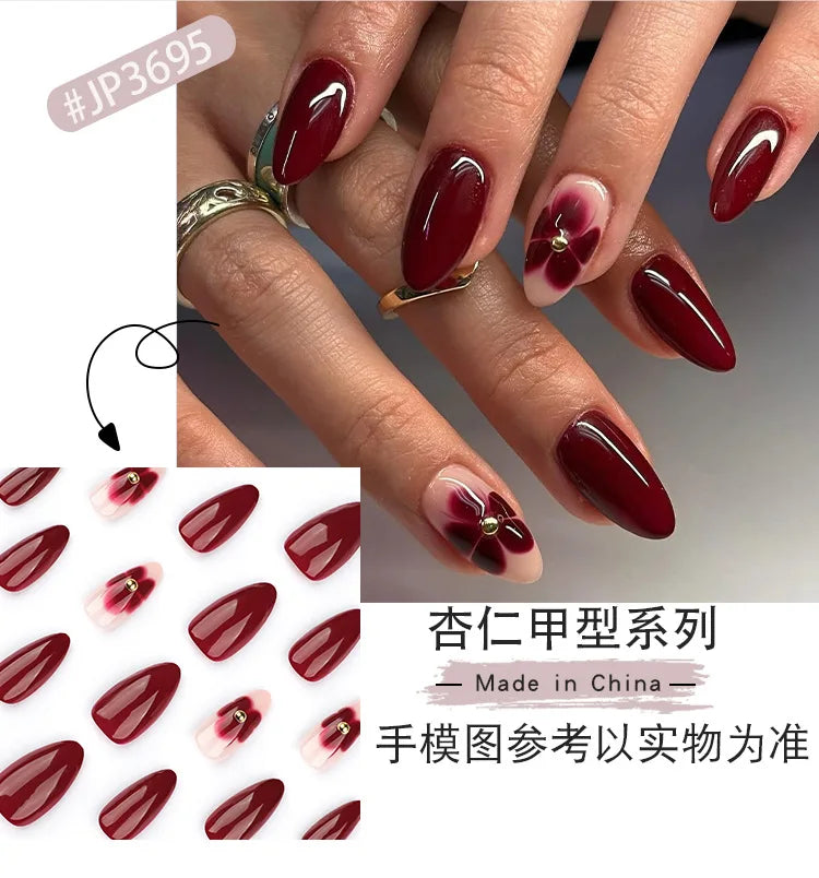 24pcs Women'S Nail Set Burgundy Almond Shape Medium Length Solid Color with Floral Golden Dust Design Fake Nails for Women/Girls.