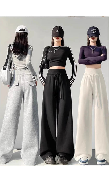 Graue Sporthose für Damen mit hoher Taille und lockerem, schlankem, geradem Bein und weitem Bein. Amerikanische Jogginghose.