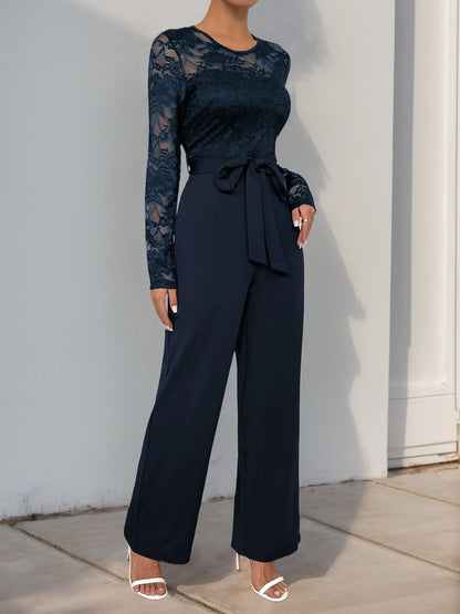 Woman Black Lace Sleeve Jumpsuit Round Neck Belted Waist Ideal for Evening Parties and Cocktail Events.
