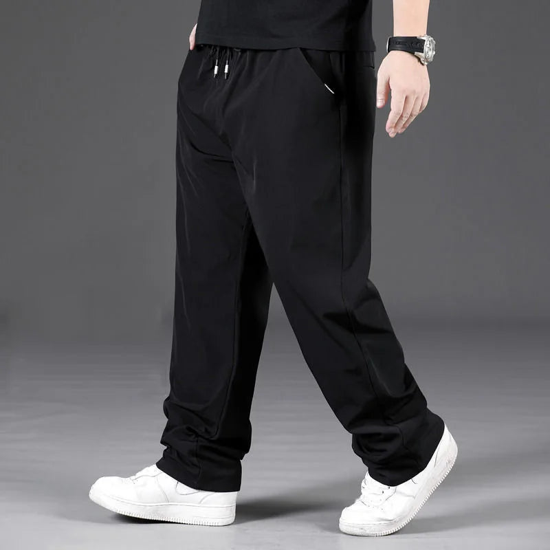 8XL Casual Pants Mens Straight Loose Trousers Men Clothing Elastic Waist Quick Dry Pants Summer Fashion Oversized Joggers Pants.