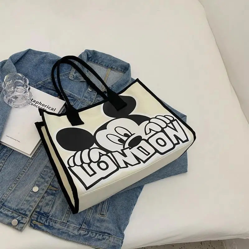 New Disney  Mickey Canvas Bag Women's Versatile Casual Shoulder Bag Commuter Handbag Large Capacity Multifunctional Mommy Bag.