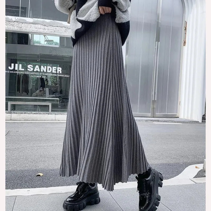 Knitted midi skirt women's A-line skirt high waist wide span mid length skirt.