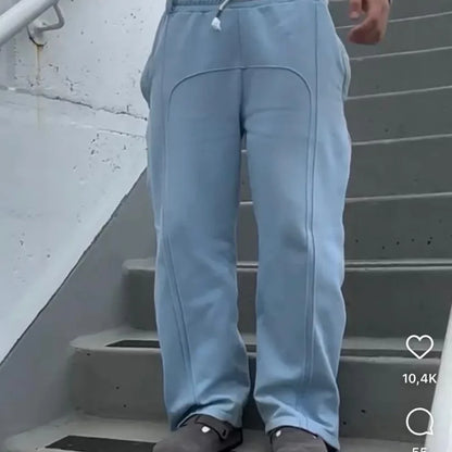 Casual Elastic Drawstring Zipper Pants High Street Hip Hop Streetwear Loose Fit Men's Trousers for Casual Scenarios.