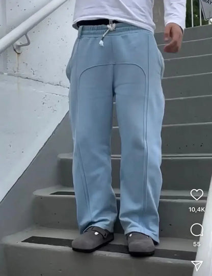 Casual Elastic Drawstring Zipper Pants High Street Hip Hop Streetwear Loose Fit Men's Trousers for Casual Scenarios.