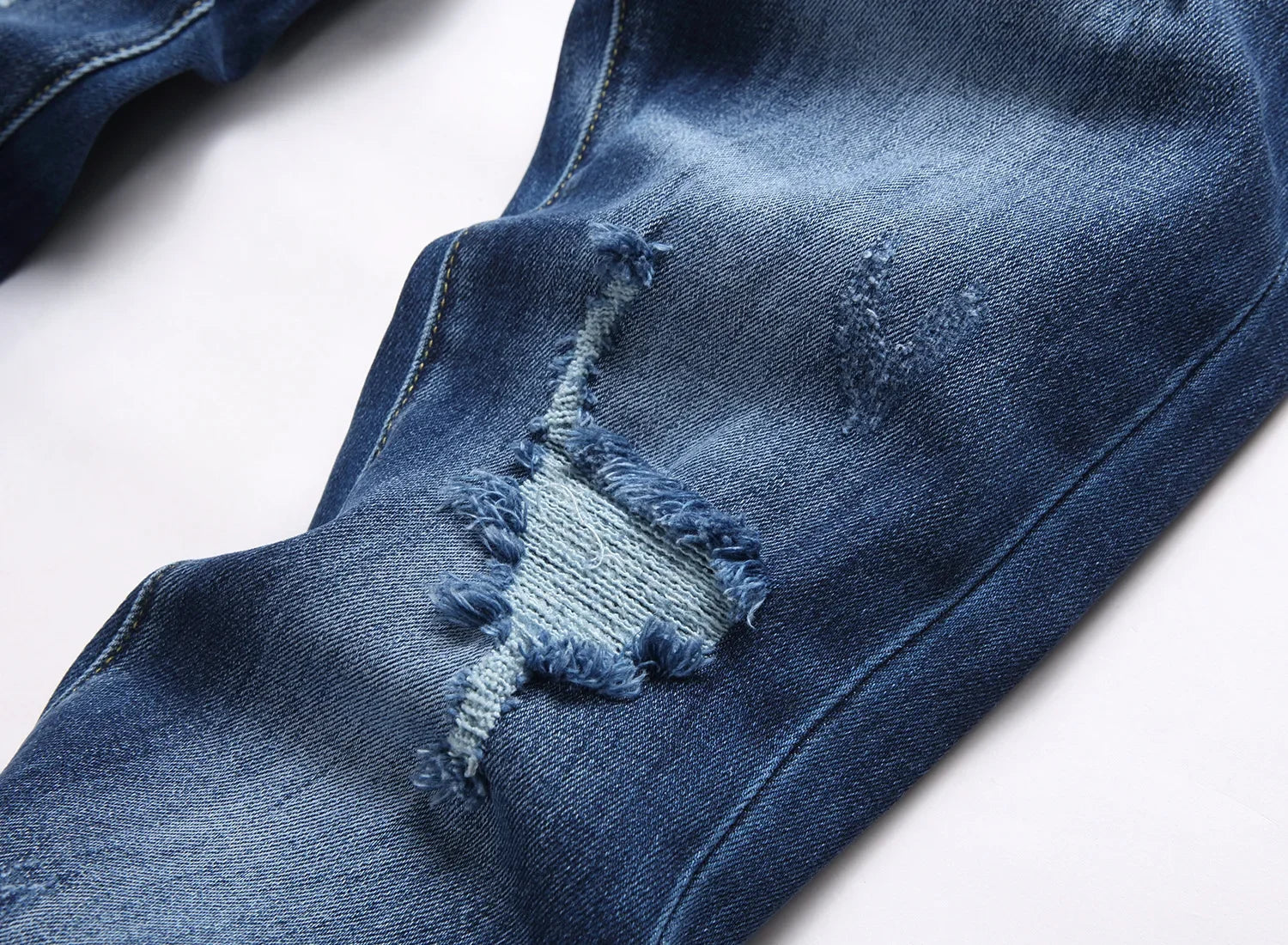 2025 Men's Ripped Jeans Luxury Brand Light Blue Holes Long Trousers Quality Male Fashion Stretch Slim Pants Men Skinny Jeans.