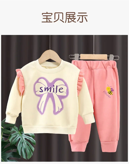 New 2025 Girls Fashion Cartoon Bowknot Letter Long Sleeve Pullover Sweatshirt + Pants Kids Spring Casual Sports Clothing Sets.