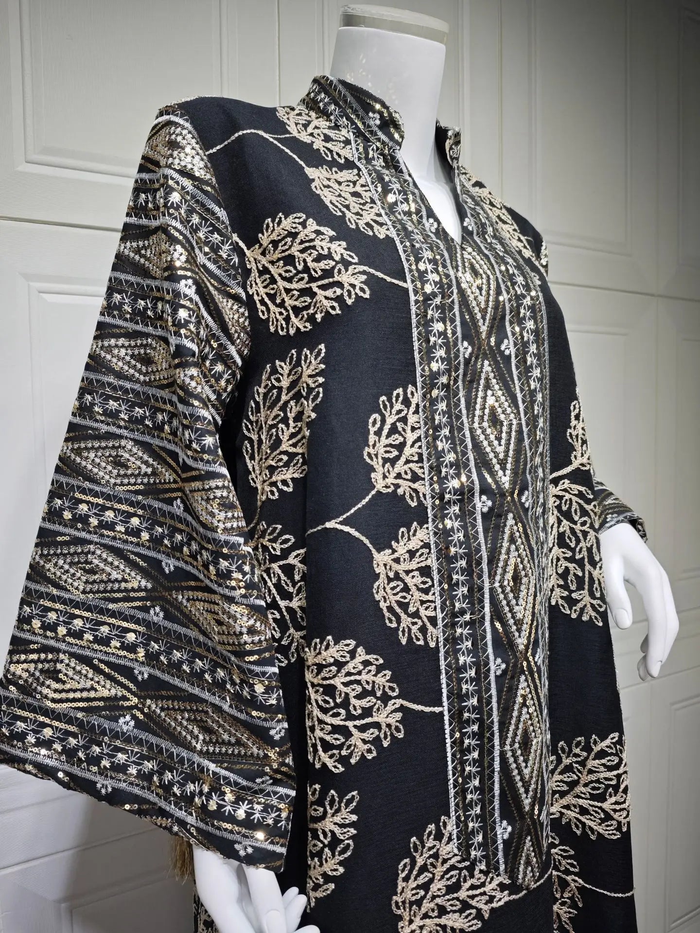 Muslim Women's Light Blue Islamic Embroidered Abaya with Gold Detailing Ideal for Formal Events in Middle East like UAE Saudi.