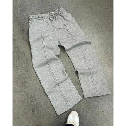 Casual Elastic Drawstring Zipper Pants High Street Hip Hop Streetwear Loose Fit Men's Trousers for Casual Scenarios.