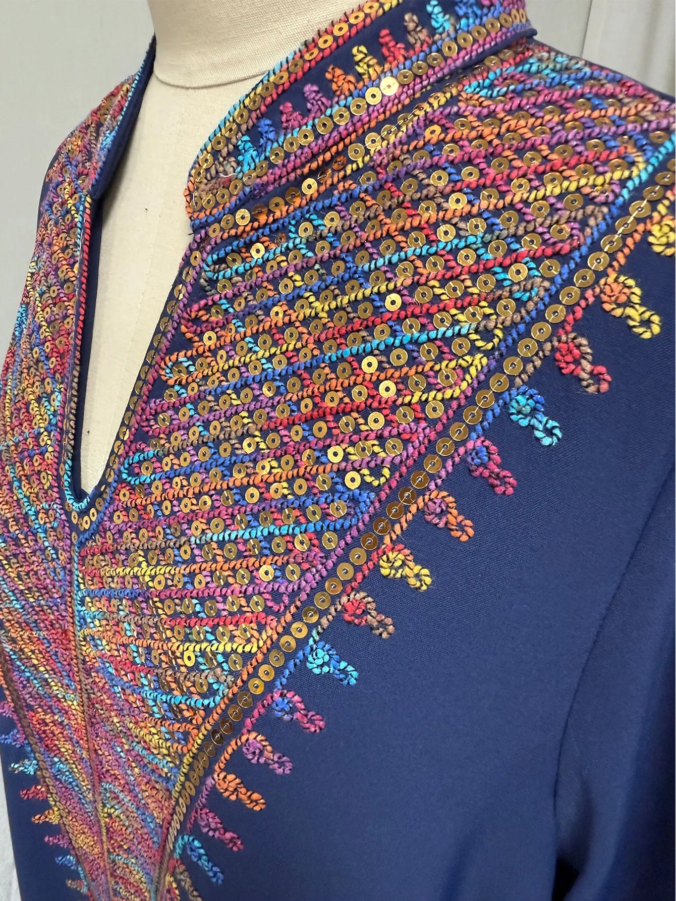 Trendy Muslim Abaya in Deep Blue Adorned with Intricate Multicolored Embroidery for Arabian Social Galas Modest Islam Fashion.