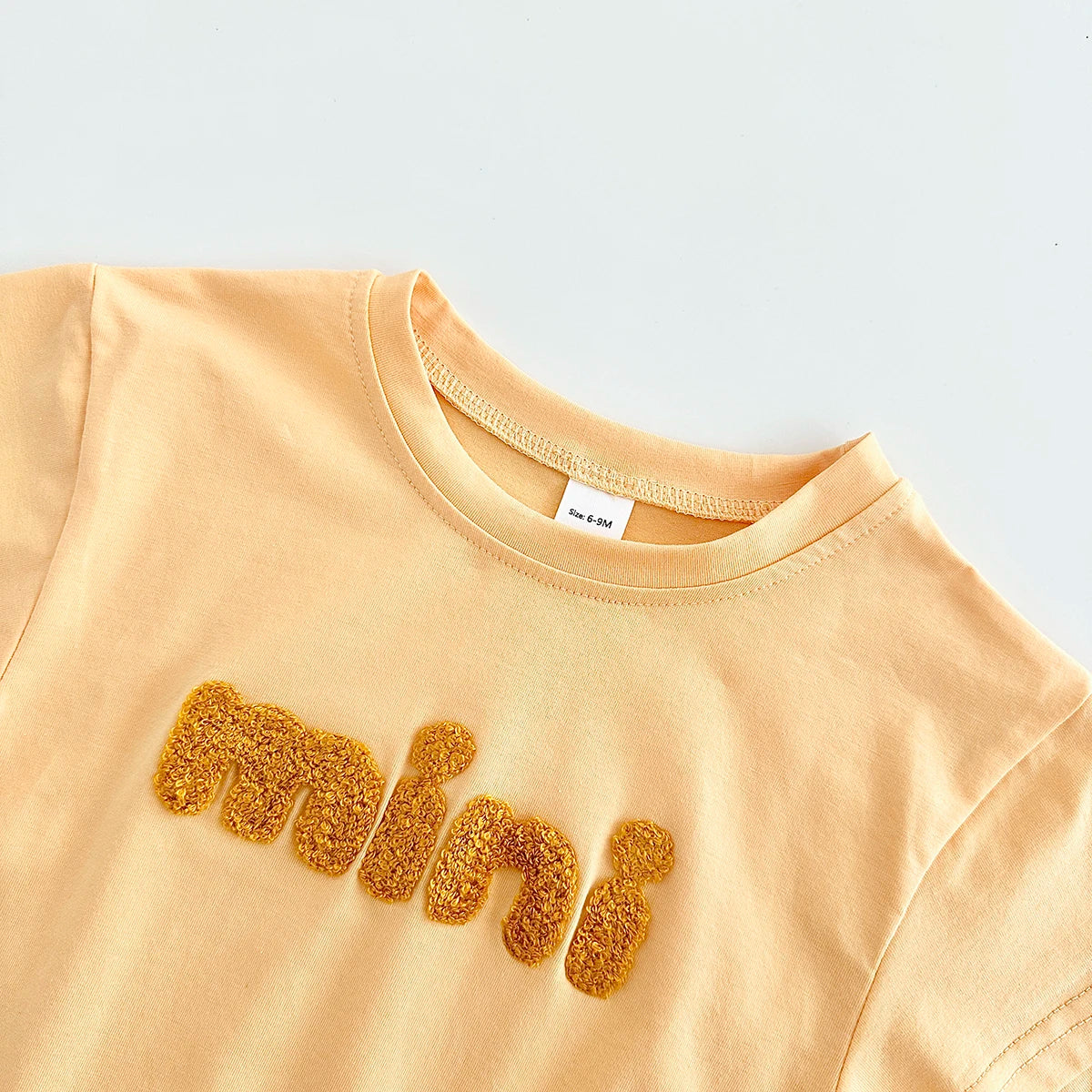 INS Sommer Neue Baby Body Neugeborenen Kleidung Jungen Mädchen Baumwolle Dreieck Strampler Plüsch brief Kurzarm Infant 0-18M