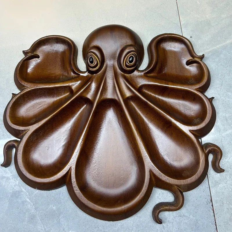 Ocean themed fresh and unique octopus cooked food tray, cheese meat fruit tray, wooden serving tray.