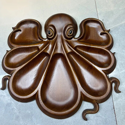 Ocean themed fresh and unique octopus cooked food tray, cheese meat fruit tray, wooden serving tray.