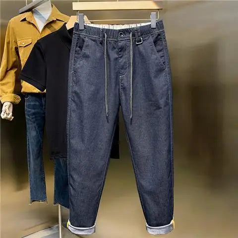 Frühling Herbst neue Mode einfarbige elastische Taille Jeans Herren bekleidung Kordel zug Taschen Chaopai lässig lose gerade Hosen.